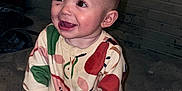 Addalynn Elizabeth joined the competition — help win amazing prizes! baby, brick_wall, child, colorful_clothing, cute, expression, eyes, face, footed_pajamas, hands, happy, indoors, infant, pajamas, patterned_clothing, portrait, sitting, smiling, texture, young_child