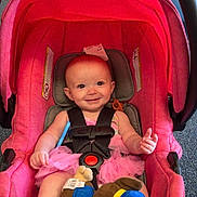 Addalynn Elizabeth is registered to the contest to win money with this photo: baby, barefoot, car_seat, child, child_safety, cute, dress, face, floor, happy, head, indoor, infant, person, pink_car_seat, plush_toy, seat_belt, smiling, toy, young_child