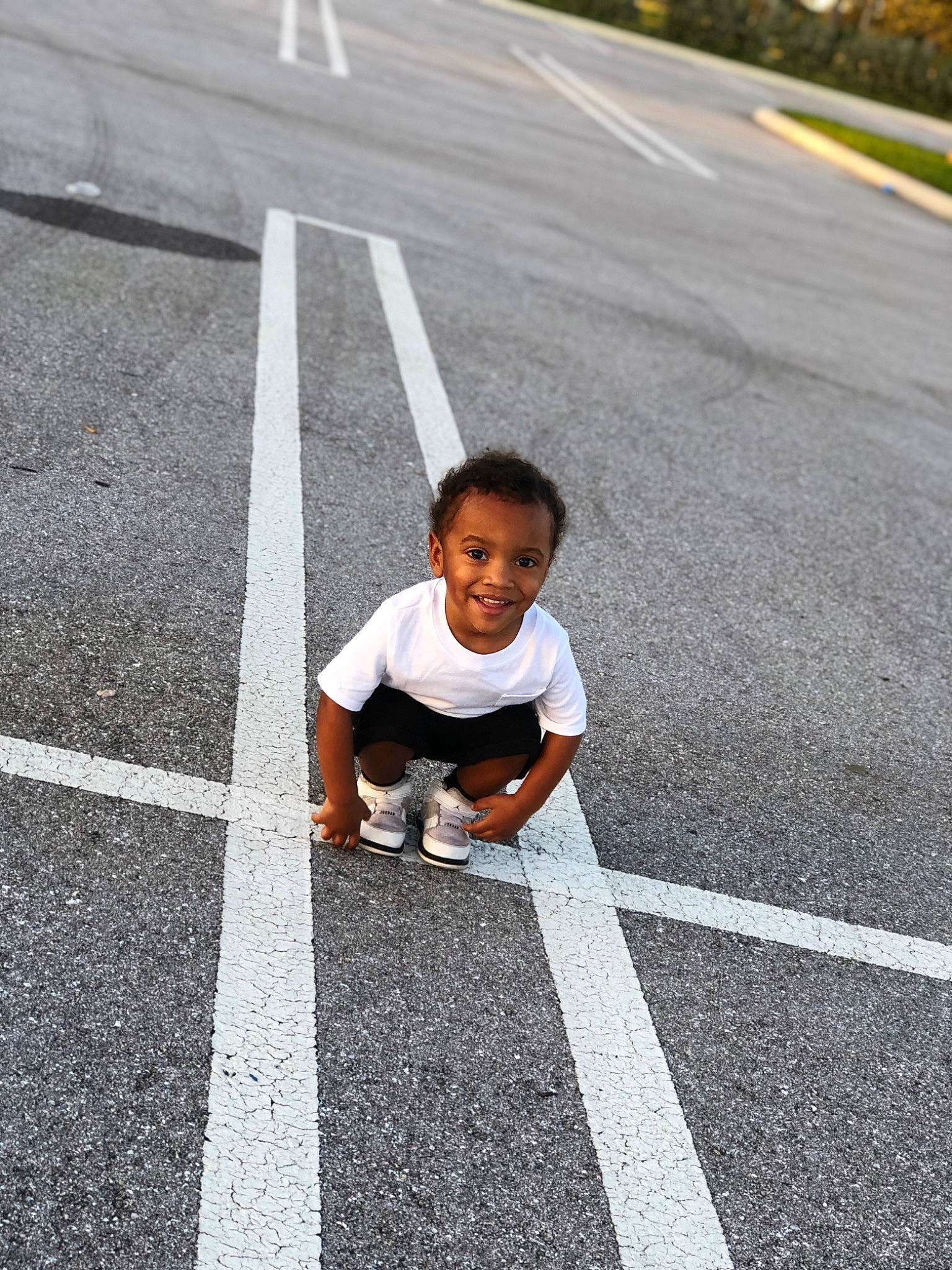Terry joined the competition — help win amazing prizes! asphalt, child, curb, infrastructure, joy, lane, line, nonbuilding_structure, person, recreation, road, road_surface, shoe, sidewalk, street