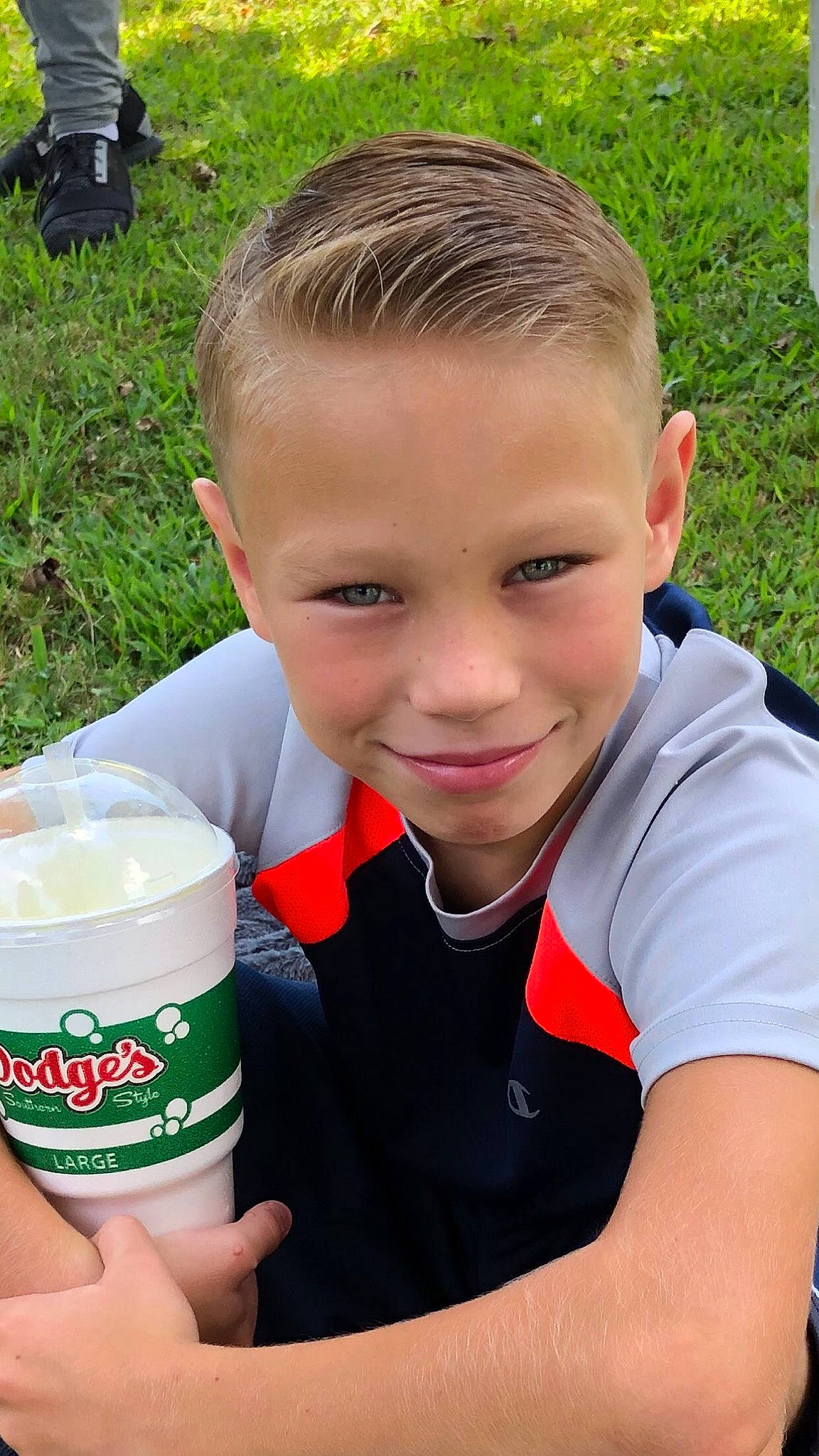 Nik Dixon is registered to the contest to win money with this photo: child, dairy, drink, grass, joy, person, smile, toddler