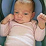 Theresia is registered to the contest to win money with this photo: baby, car_seat, child, cushion, cute, eyes, face, fist, hand, head, indoors, infant, newborn, onesie, person, pink_clothing, portrait, resting, skin, sleeve