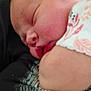 baby, newborn, sleeping, face, closeup, infant, child, person, skin, ear, mouth, adult, glasses, couch, fabric, pattern, floral, comfort, rest, peaceful
