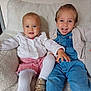 toddler, child, smiling, happy, indoor, sweater, denim, blue_eyes, cute, sitting, chair, cozy, warm_clothing, portrait, two_children, playful, baby, fashion, candid, family