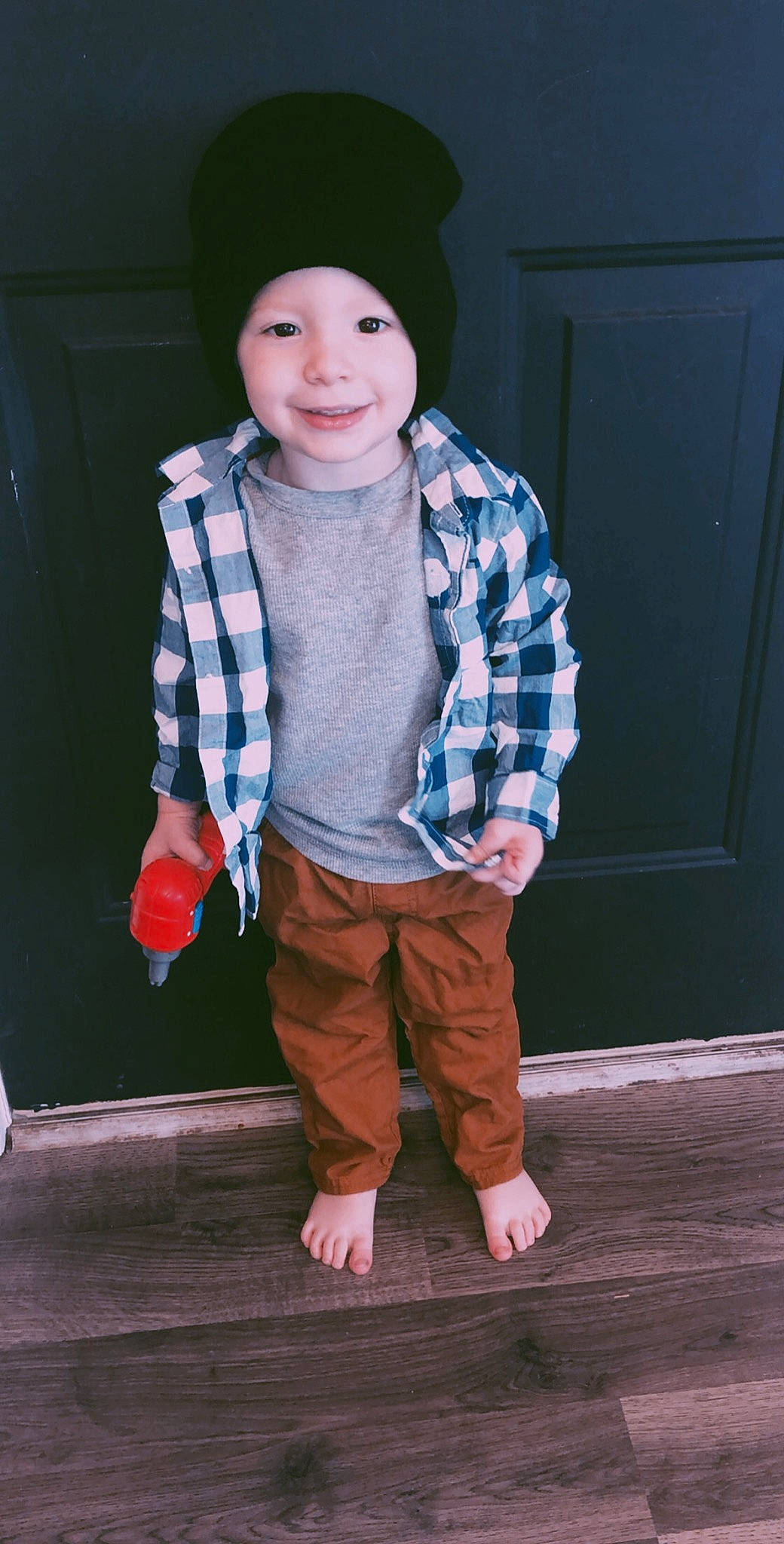 Izaak is registered to the contest to win money with this photo: child, child_model, joy, outerwear, person, standing, t_shirt, toddler