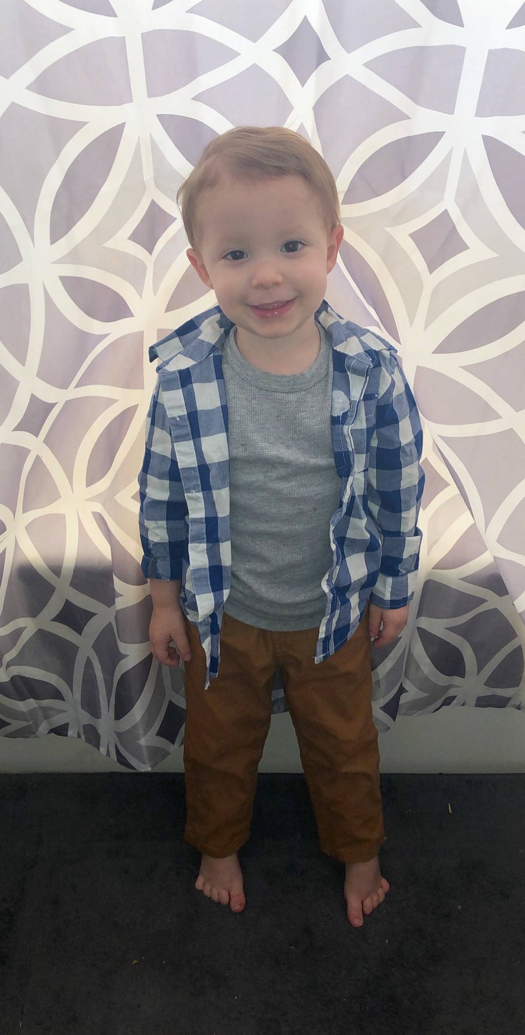 Izaak is registered to the contest to win money with this photo: baby, child, design, joy, outerwear, pattern, person, sitting, smile, standing, t_shirt, toddler