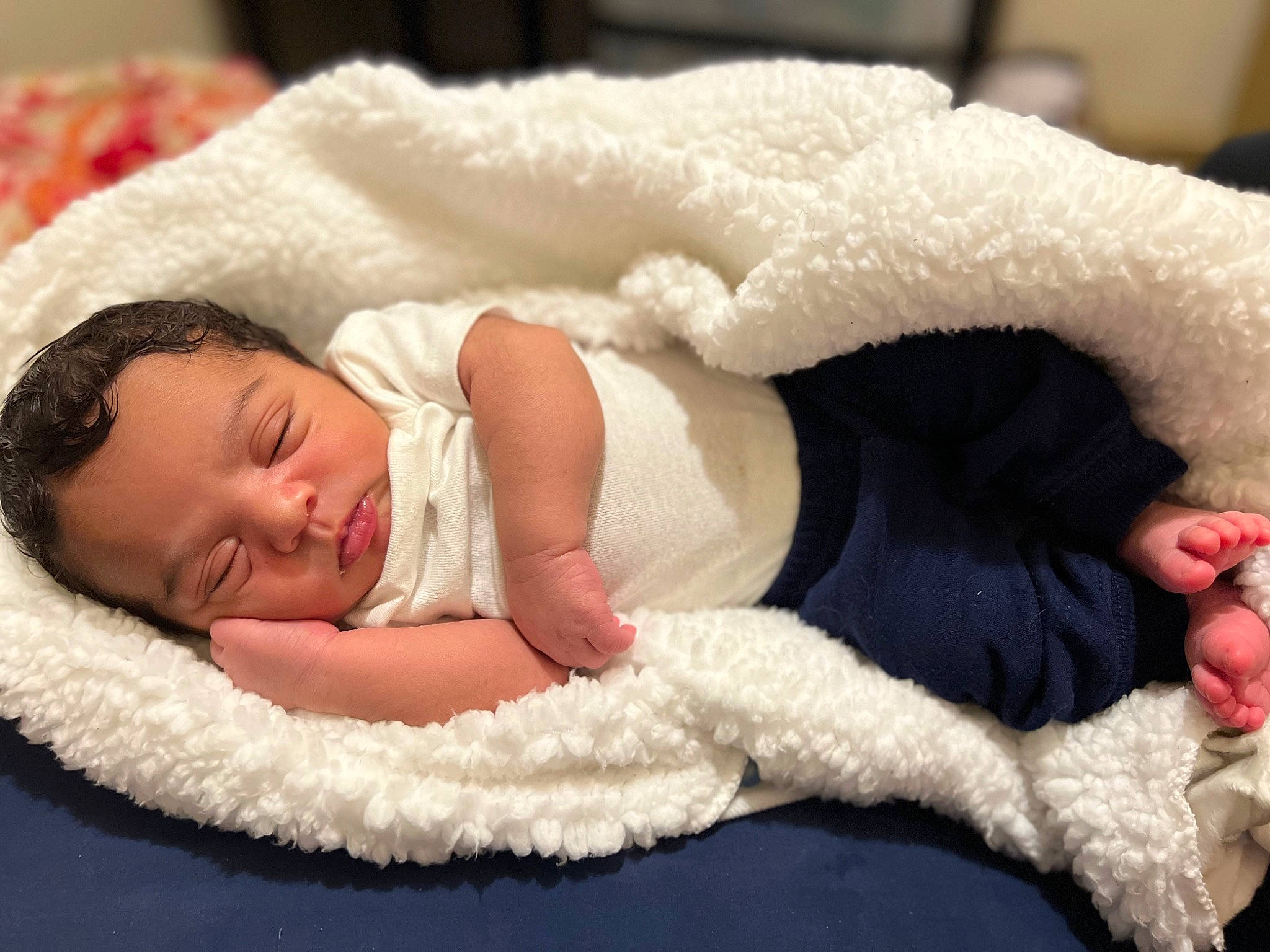 Cassius is registered to the contest to win money with this photo: baby, baby_products, baby_sleeping, baby_toddler_clothing, child, comfort, event, fashion_accessory, finger, flooring, fur, hand, headgear, knit_cap, linens, person, skin, textile, toddler, towel