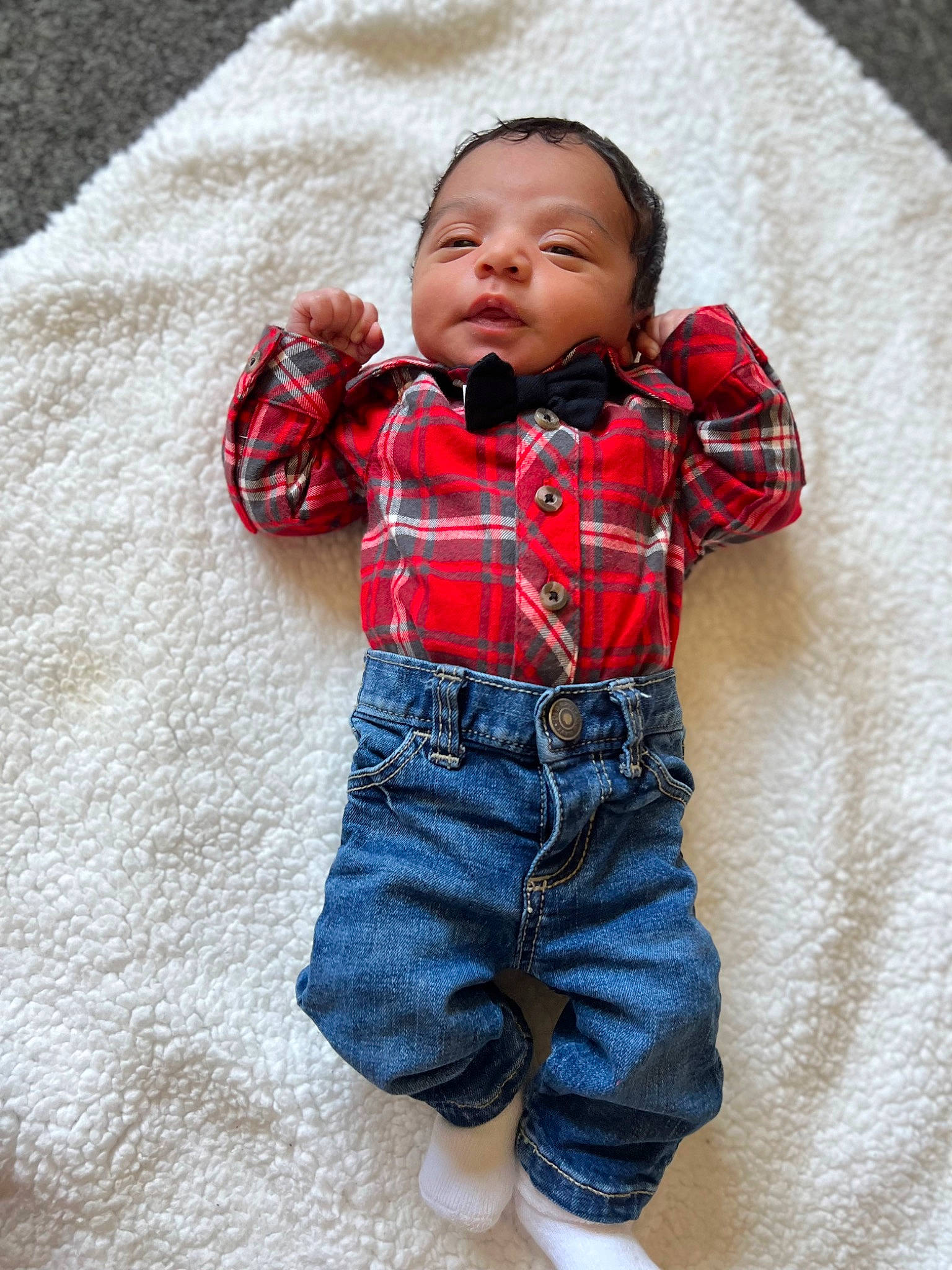 Cassius joined the competition — help win amazing prizes! baby, baby_toddler_clothing, cheek, collar, comfort, eye, flooring, grey, happy, head, linens, nose, outerwear, pattern, person, plaid, skin, sleeve, textile, toddler