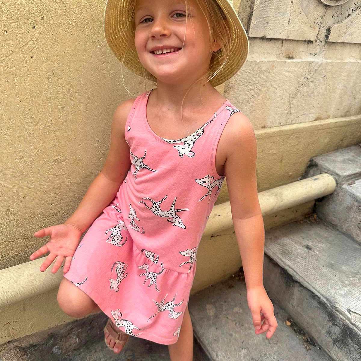Ornella participe au concours pour gagner de l'argent avec cette photo : beachwear, child, clothing, dress, face, female, girl, hair, happy, hat, head, person, photography, portrait, sitting, skirt, sleeve, smile, standing, sunhat