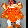 Eve joined the competition — help win amazing prizes! baby, infant, child, halloween, orange_dress, pumpkin, headband, white_leggings, black_shoes, cute, lying_down, festive, holiday, costume, soft_surface, adorable, small_hands, smiling, toddler, indoors