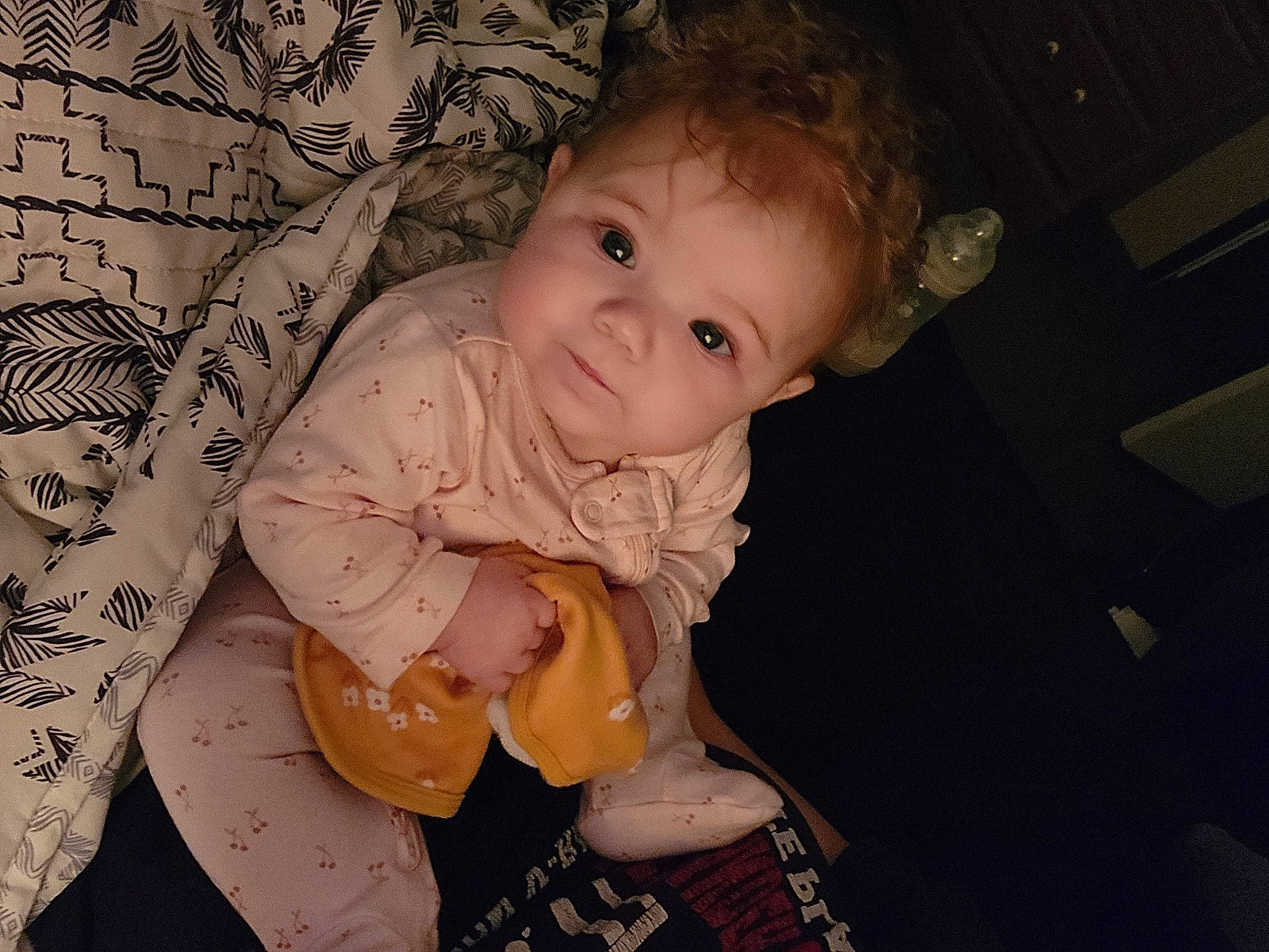 Ila is registered to the contest to win money with this photo: baby, baby_toddler_clothing, cheek, chest, child, comfort, facial_expression, finger, flash_photography, fun, happy, iris, mouth, neck, pattern, person, sitting, skin, sleeve, toddler