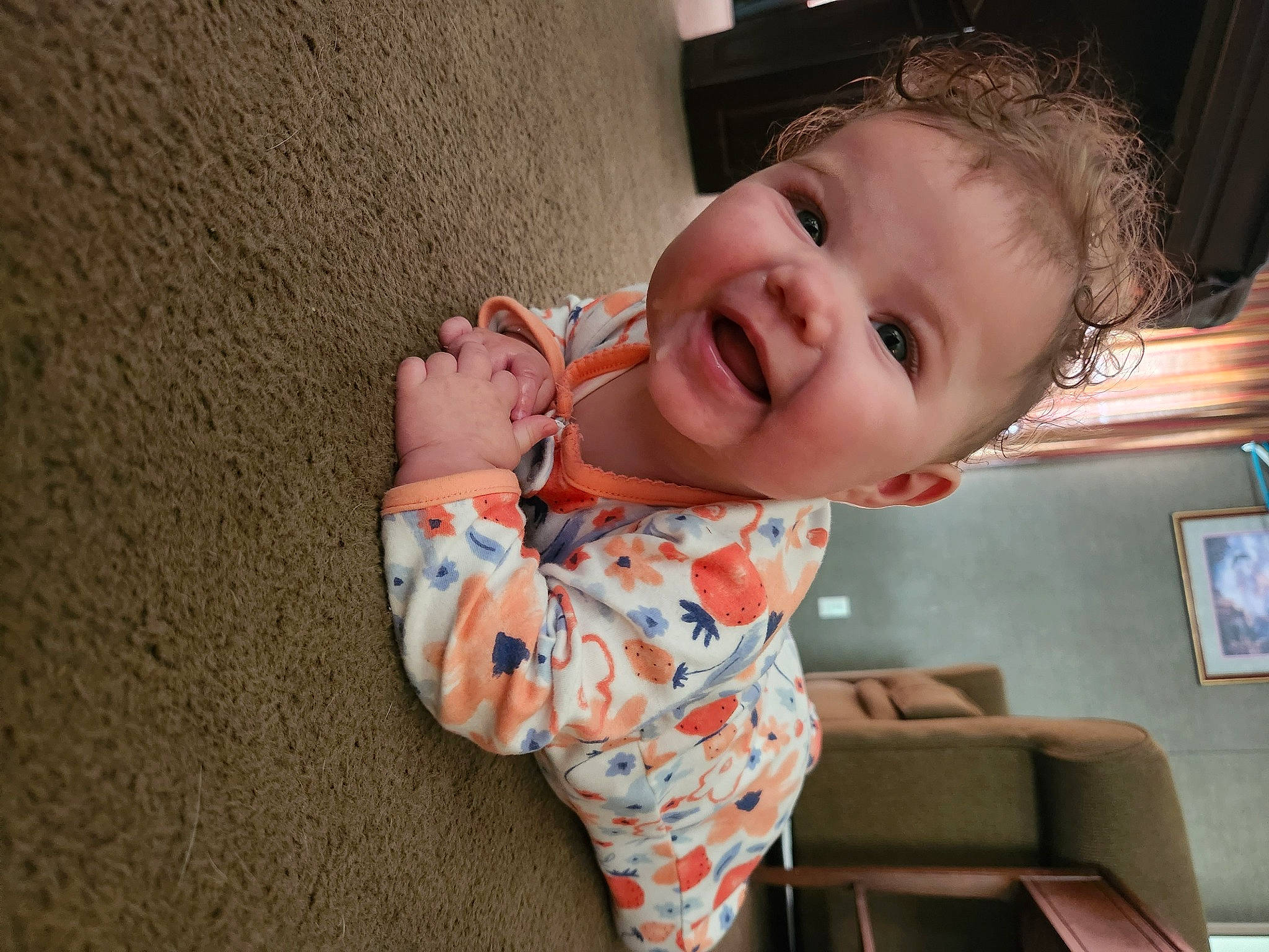 Ila is registered to the contest to win money with this photo: arm, baby, baby_toddler_clothing, cheek, comfort, facial_expression, finger, gesture, hand, happy, human_body, iris, joint, lip, mouth, nose, person, skin, sleeve, smile