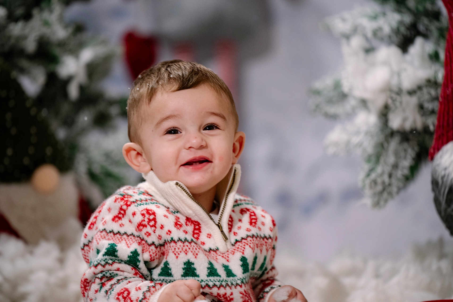Kristiyan is registered to the contest to win money with this photo: toddler, child, smiling, christmas_sweater, holiday, winter, festive, cute, portrait, indoor, happy, young_child, face, warm_clothing, seasonal, celebration, snow, background_blur, joyful, cheerful