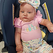Blakelynn joined the competition — help win amazing prizes! baby, infant, car_seat, headband, bow, pink_shirt, shorts, clothing, cute, child, person, sitting, serious_expression, indoor, pattern, fringe, cowgirl, outfit, skin, hand