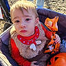 Aaron joined the competition — help win amazing prizes! child, toddler, baby, portrait, face, blond_hair, blue_eyes, wide_eyes, outdoor, sunlight, stroller, red_clothing, furry_vest, halloween, treat_bag, orange, pumpkin, autumn, seated, close_up