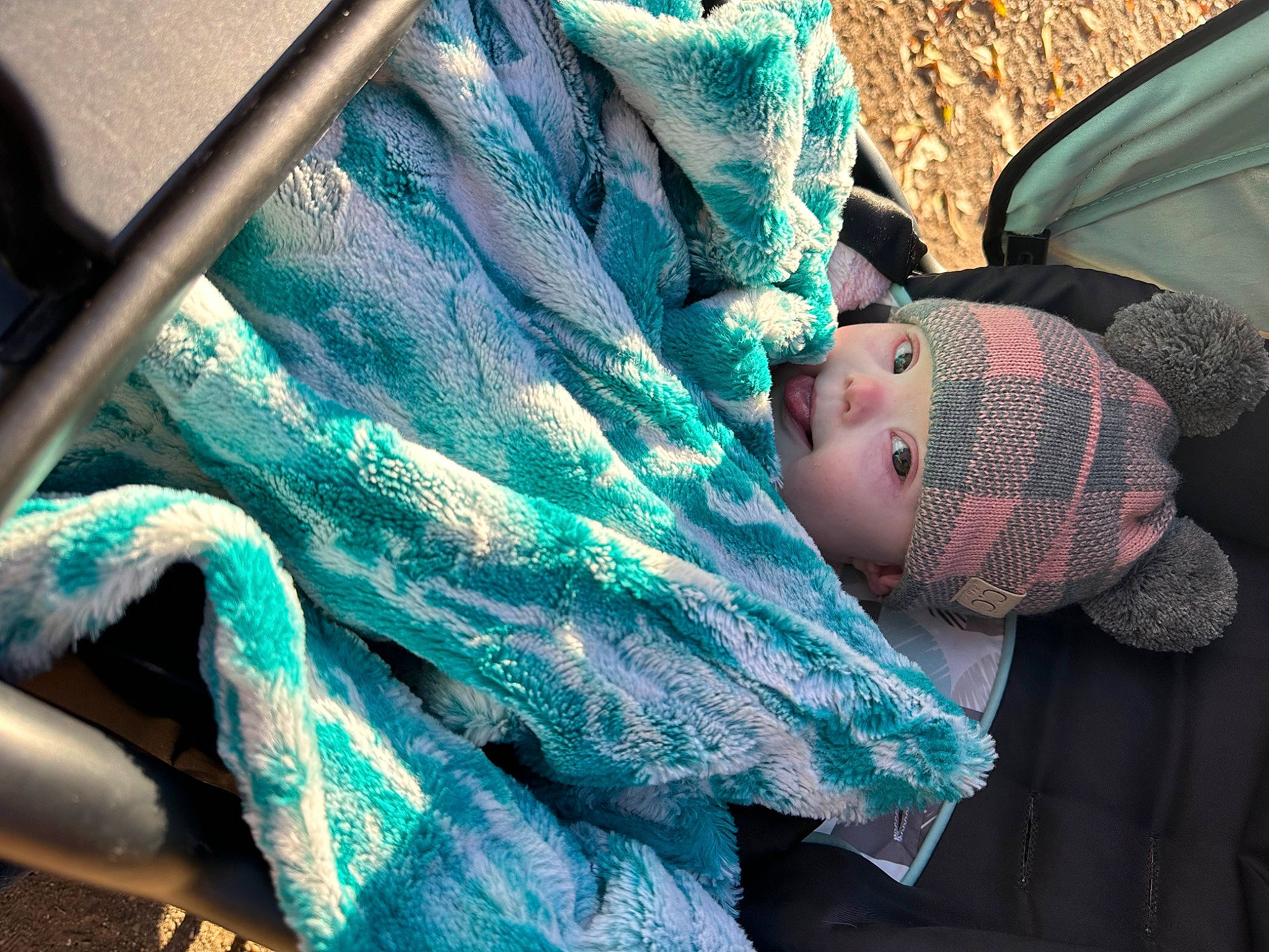 Matilda is registered to the contest to win money with this photo: baby, baby_products, beauty, child, comfort, cool, electric_blue, fashion_accessory, green, hand, headwear, linens, mammal, pattern, person, product, sitting, textile, tints_and_shades, toddler