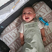Haloo joined the competition — help win amazing prizes! baby, smiling, infant, playpen, blanket, toy, overalls, cute, happy, child, lying_down, indoors, soft, clothing, face, person, baby_toy, expression, playtime, comfort
