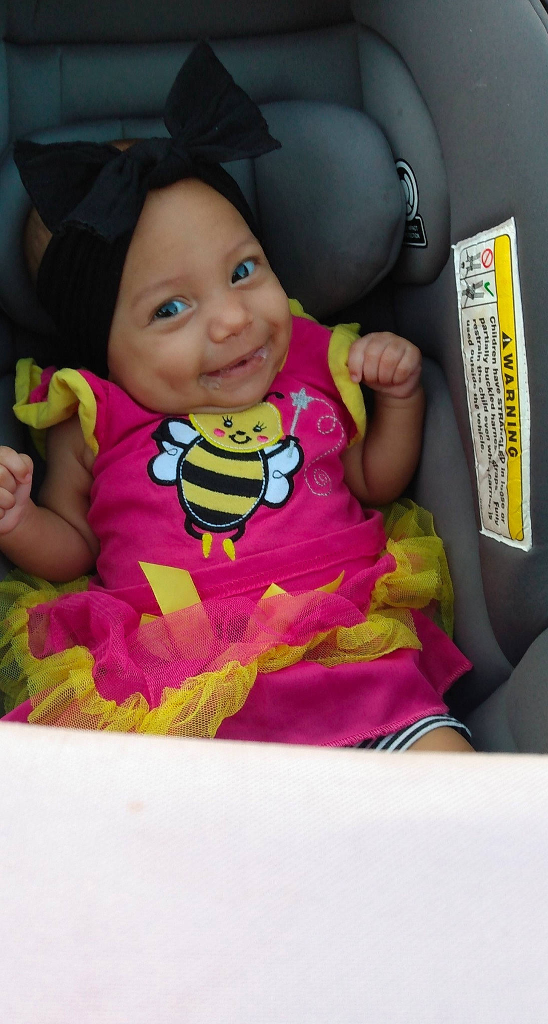 Felicity is registered to the contest to win money with this photo: baby, baby_carriage, baby_in_car_seat, baby_products, baby_toddler_clothing, car_seat, cheek, child, comfort, family_car, fun, happy, headwear, joy, magenta, person, play, sitting, sleeve, smile