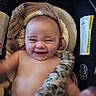baby, blanket, car_seat, child, comfort, cute, diaper, expression, face, happy, head, indoor, infant, knitted_blanket, person, plush_toy, skin, smile, toy, young_child