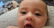Royal is registered to the contest to win money with this photo: baby, infant, close_up, bottle, mouth_open, expression, skin, blanket, indoor, face, child, young, cute, person, feeding, relaxed, soft_focus, home, comfort, sleepy