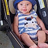 baby, child, smiling, hat, blue_hat, striped_clothing, cow_design, car_seat, infant, cute, happy, sitting, face, portrait, child_seat, outdoor, feet, person, young_child, headwear