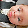 baby, car_seat, child, child_seat, close_up, cute, expression, eyes, face, head, indoors, infant, person, portrait, safety, seatbelt, skin, small_child, white_clothing, young_child