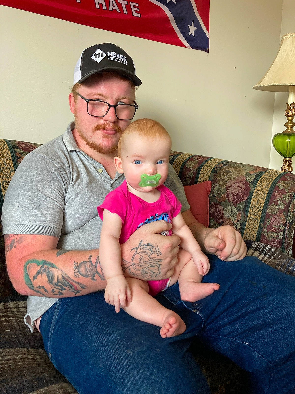 Aliyah joined the competition — help win amazing prizes! baby, baseball_cap, cap, child, comfort, couch, event, flooring, fun, happy, hat, headwear, human, human_leg, lamp, lap, person, sitting, t_shirt, thigh