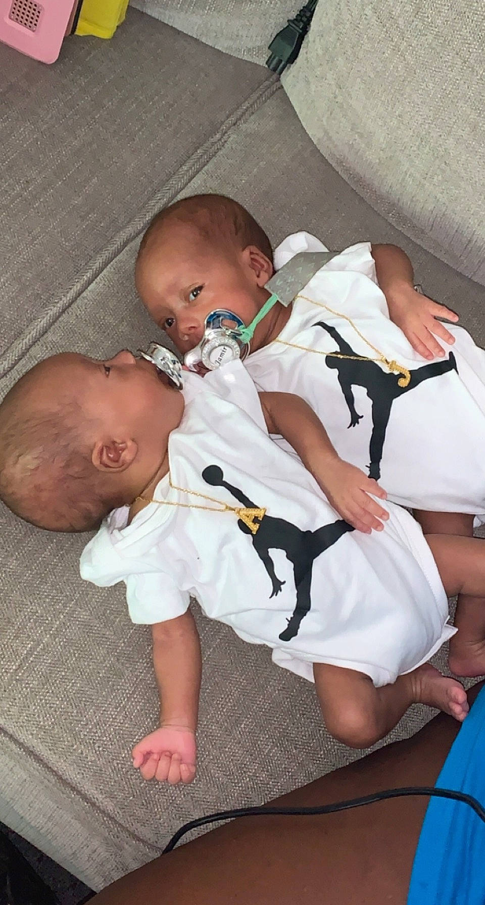 Amir Jamir is registered to the contest to win money with this photo: baby, baby_products, baby_toddler_clothing, cheek, child, comfort, flooring, foot, fun, human_leg, lap, linens, nail, person, product, room, sitting, skin, sock, thigh