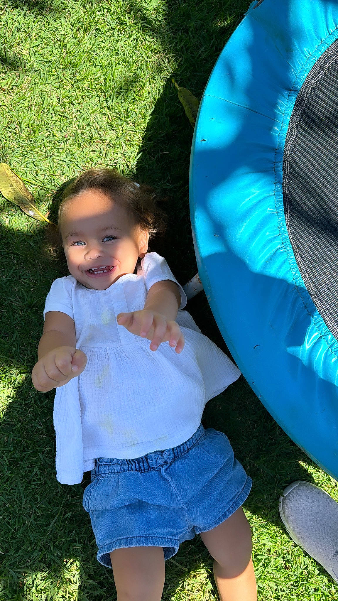 Aaliyah is registered to the contest to win money with this photo: baby, baby_toddler_clothing, beauty, blue, child, electric_blue, fun, grass, green, happy, joy, leaf, leisure, people_in_nature, person, recreation, shorts, sitting, summer, t_shirt