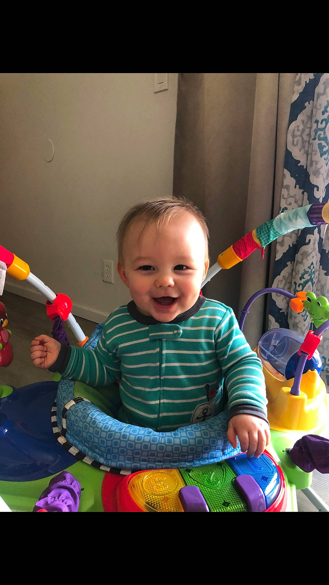 Grayson is registered to the contest to win money with this photo: baby, baby_playing_with_toys, baby_products, baby_toddler_clothing, baby_toys, child, curtain, event, fun, happy, joy, laugh, party, person, play, recreation, room, sitting, smile, standing