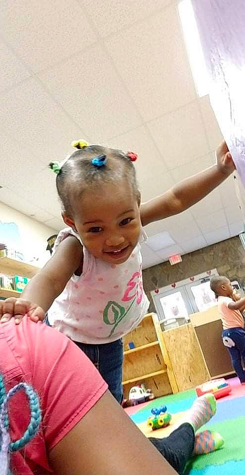 Serenity K is registered to the contest to win money with this photo: baby, cheek, child, ear, fun, joy, leisure, person, play, room, sitting, smile, toddler, toy