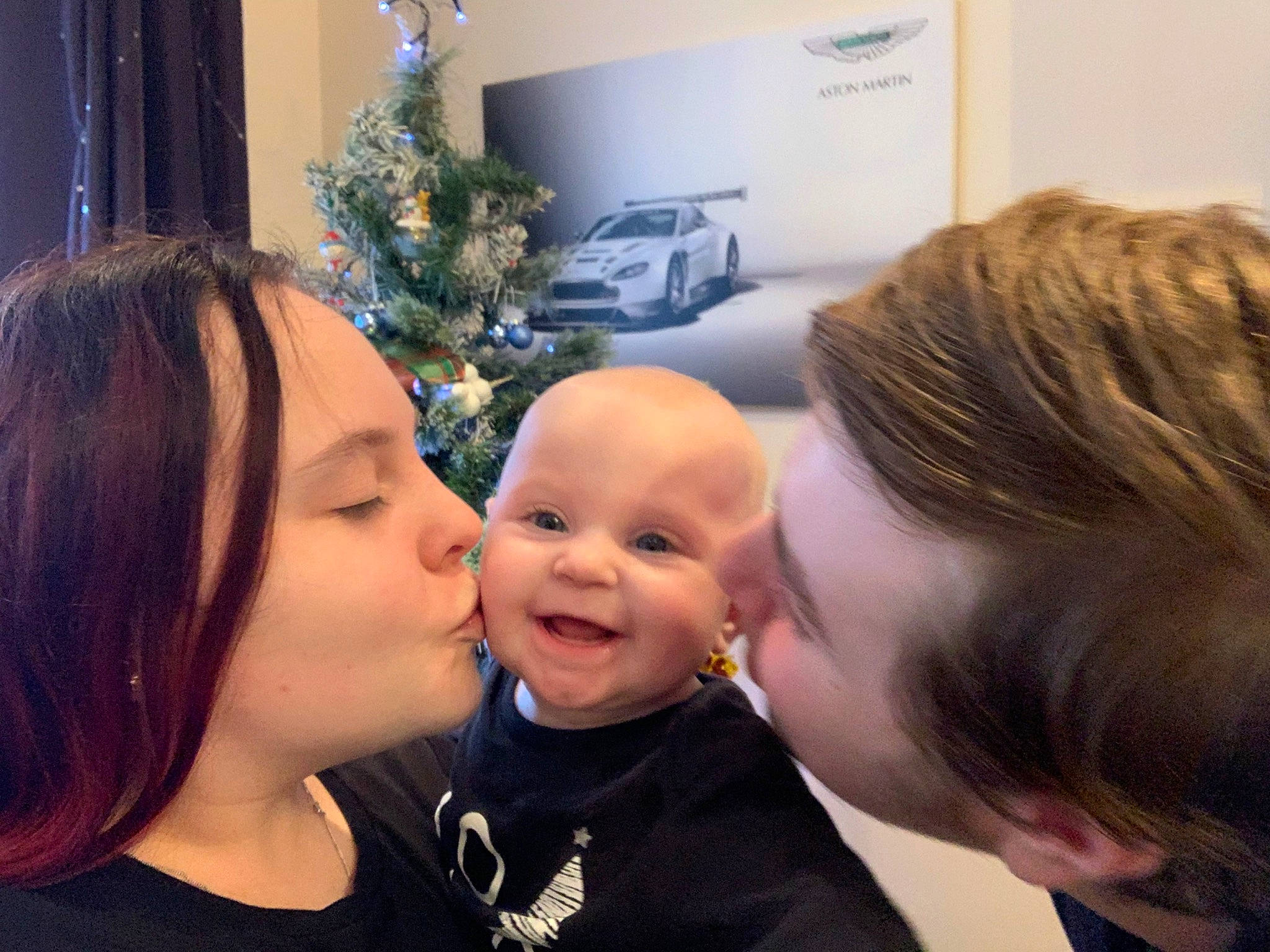 Lilly-rose is registered to the contest to win money with this photo: cheek, child, christmas, ear, face, family, forehead, fun, happy, head, holiday, interaction, love, mother, nose, person, sky, smile, toddler