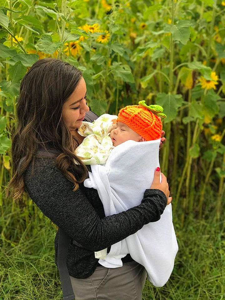 Ezra is registered to the contest to win money with this photo: ceremony, flower, fun, garden, girl, grass, happiness, hug, interaction, love, person, plant, smile, tree