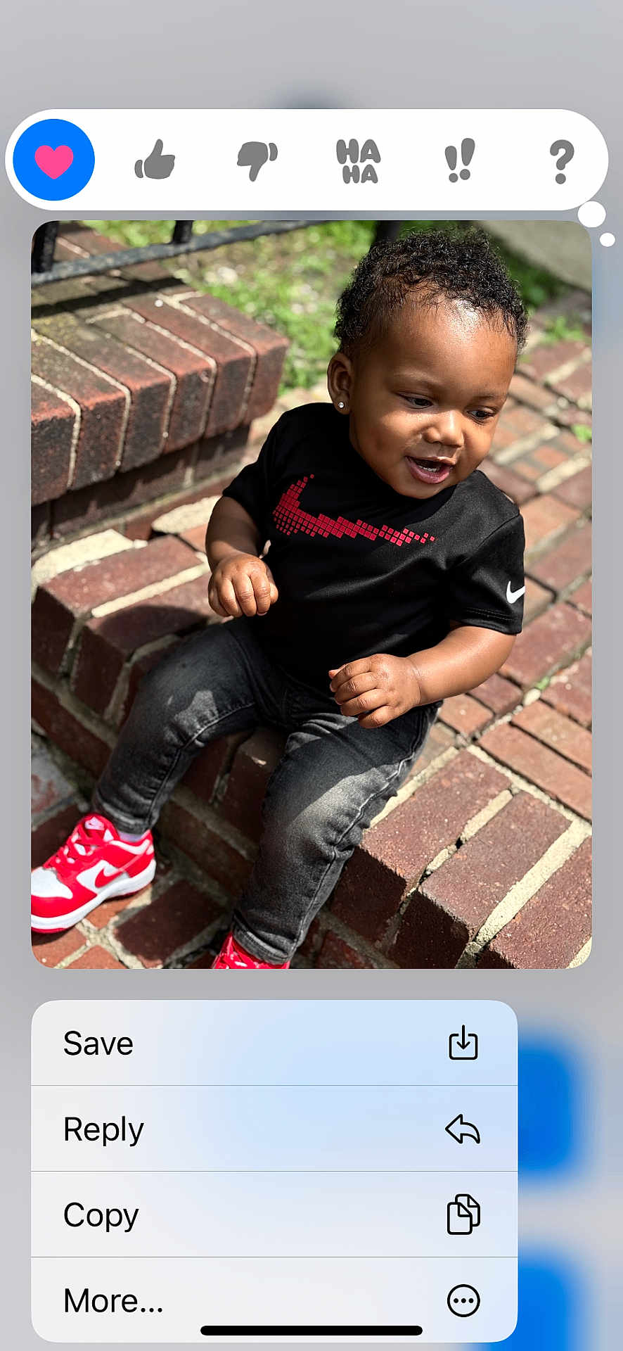 Dmirio Gibson joined the competition — help win amazing prizes! toddler, child, sitting, brick, steps, black_shirt, nike, red_sneakers, curly_hair, earrings, outdoor, happy, smiling, casual_clothing, daylight, person, fashion, cute, playful, portrait