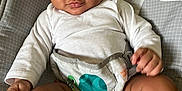 Messiah joined the competition — help win amazing prizes! baby, child, infant, curly_hair, onesie, diaper, baby_seat, pattern, turtle, smile, skin, cute, indoor, closeup, face, legs, hand, comfort, seat, expression
