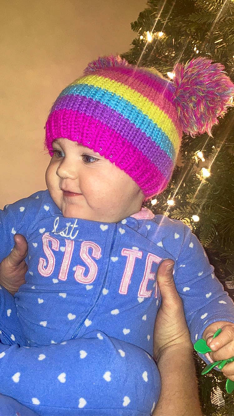 Stella Rose is registered to the contest to win money with this photo: baby, baby_toddler_clothing, cap, child, electric_blue, face, facial_expression, fun, happy, headgear, headwear, knit_cap, magenta, person, pink, purple, red, sleeve, smile, toddler