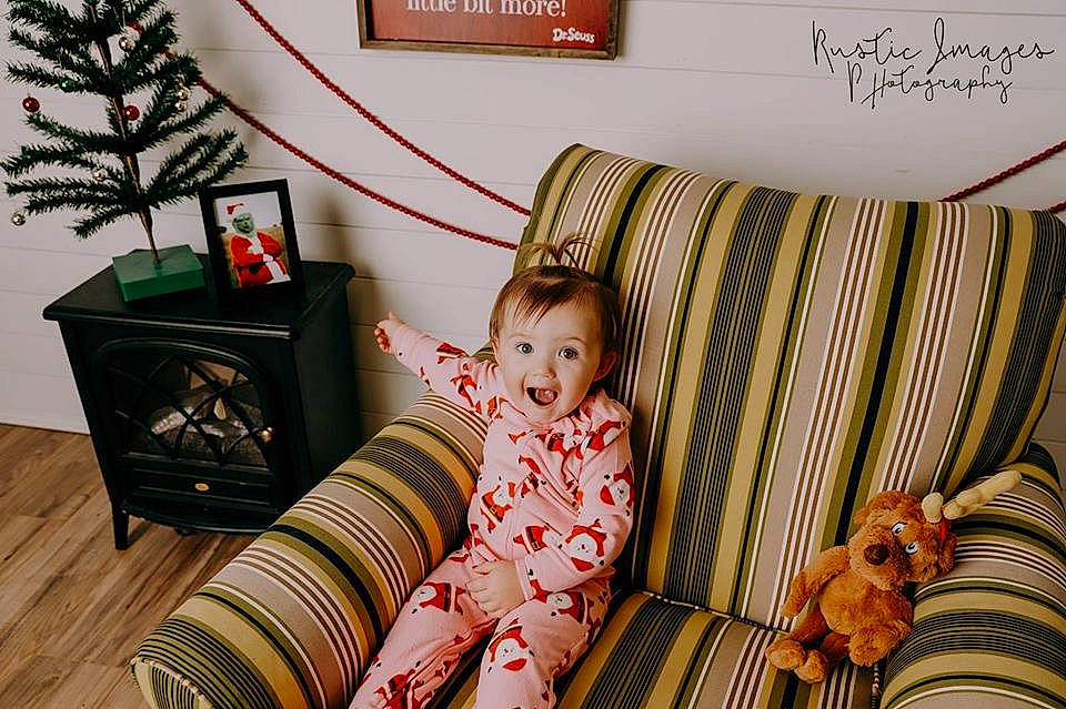 Leslie joined the competition — help win amazing prizes! baby, child, comfort, couch, furniture, home, interior_design, person, product, red, room, sitting, toddler