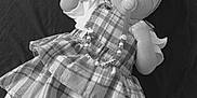 Valentina-Rose is registered to the contest to win money with this photo: baby, bonnet, cap, clothing, costume, couch, doll, dress, face, figurine, furniture, hat, head, person, photography, portrait, sitting, skirt, tartan, toy