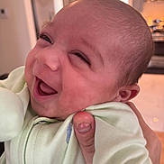 Lorenzo joined the competition — help win amazing prizes! baby, infant, smile, laugh, face, person, hand, clothing, indoor, home, kitchen, light, joy, cute, newborn, expression, skin, human, holding, happiness