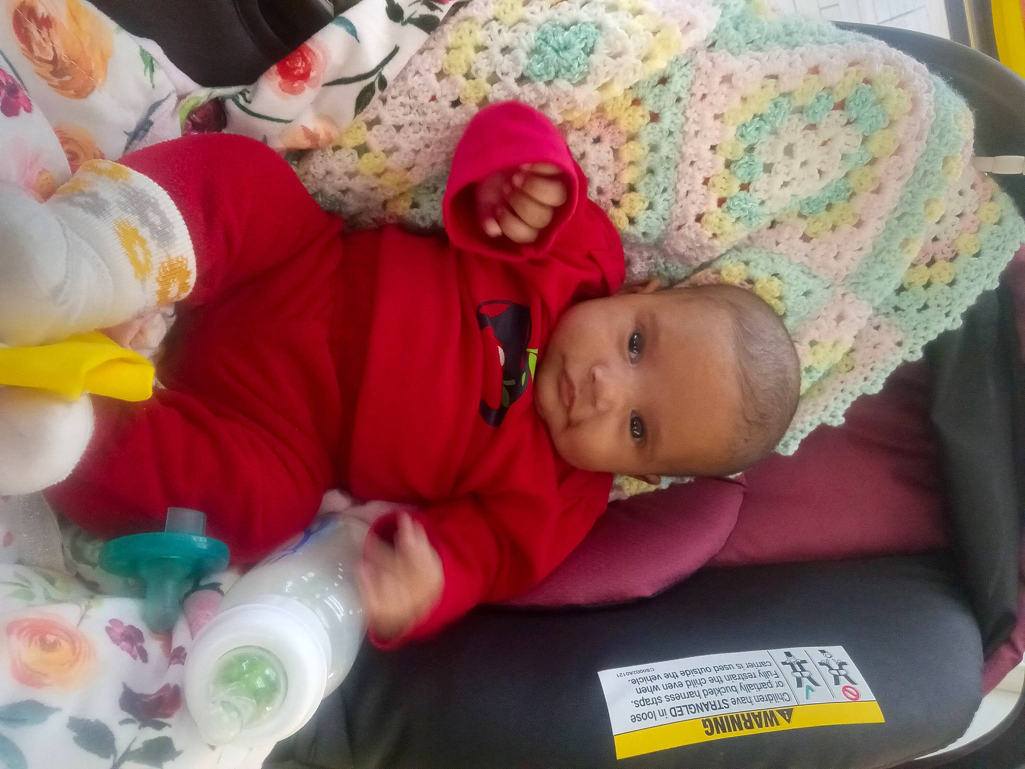 Aliana is registered to the contest to win money with this photo: baby, baby_products, baby_toddler_clothing, car_seat, child, comfort, event, fun, hat, lap, linens, nap, person, plastic_bottle, room, sitting, skin, sleep, toddler