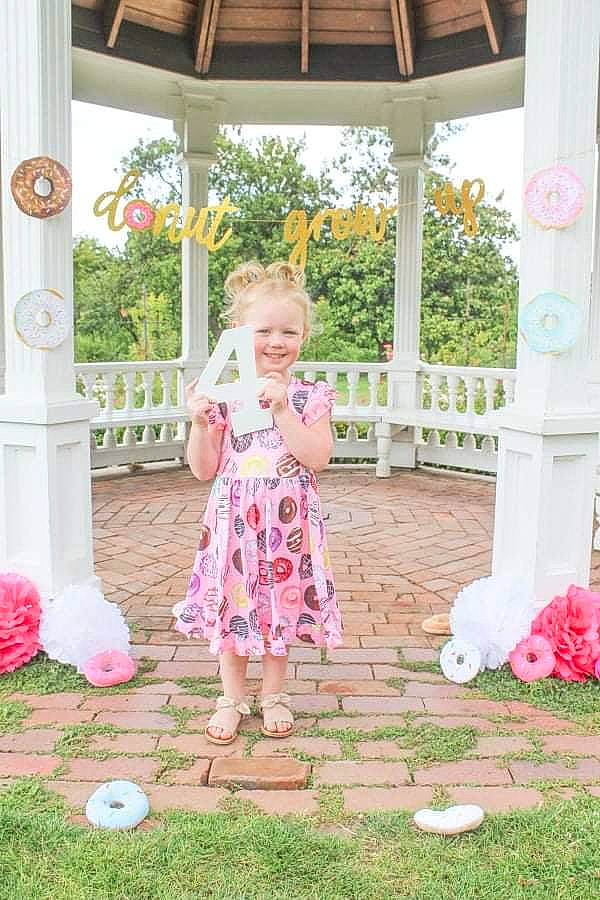 Aubrey joined the competition — help win amazing prizes! botany, clothing, dress, fun, grass, green, happy, head, human_body, joy, leisure, orange, people_in_nature, person, pink, plant, red, smile, standing, toddler