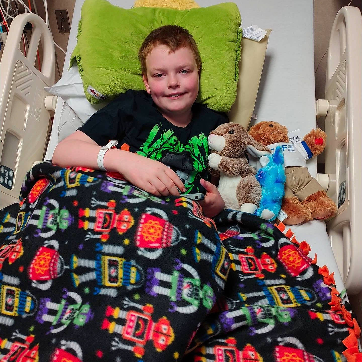 Michael joined the competition — help win amazing prizes! chair, child, comfort, couch, event, happy, holiday, joy, leisure, linens, living_room, pattern, person, room, sitting, sleeve, smile, t_shirt, textile, throw_pillow