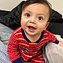 Josiah is registered to the contest to win money with this photo: baby, bodypart, clothing, couch, cushion, face, finger, furniture, hand, happy, head, homedecor, indoors, pants, person, photography, portrait, sitting, smile, t_shirt