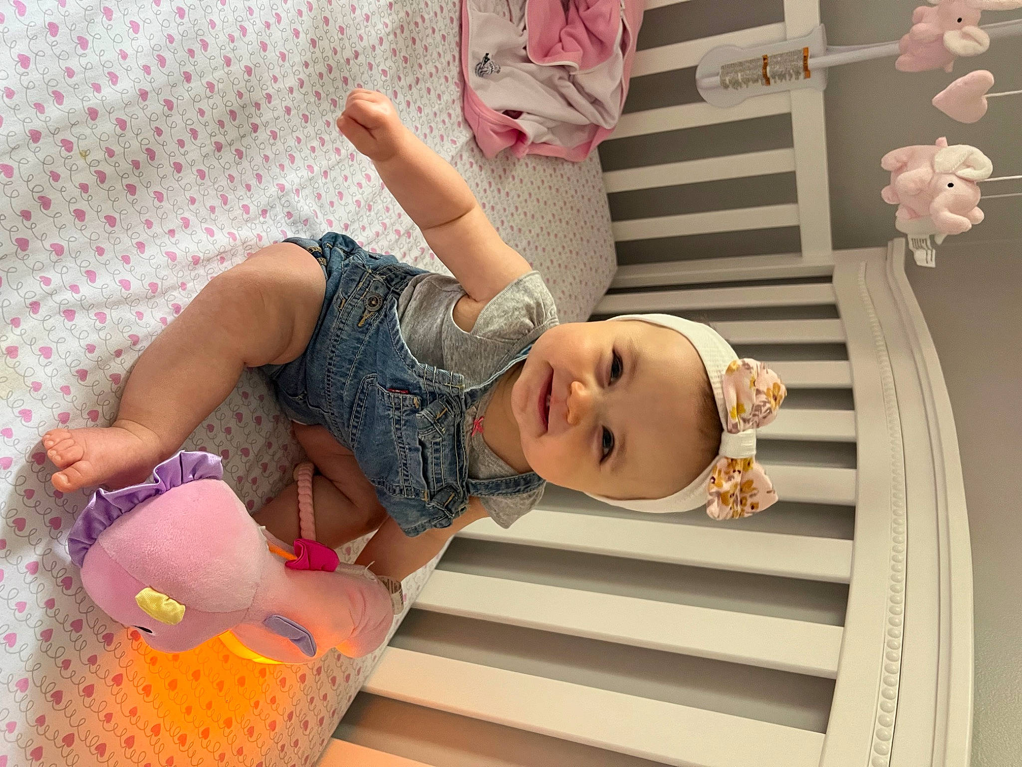 Layla is registered to the contest to win money with this photo: baby, baby_toddler_clothing, child, door, foot, fun, happy, human_leg, leisure, pattern, person, pink, product, room, smile, sock, textile, thigh, toddler, toy