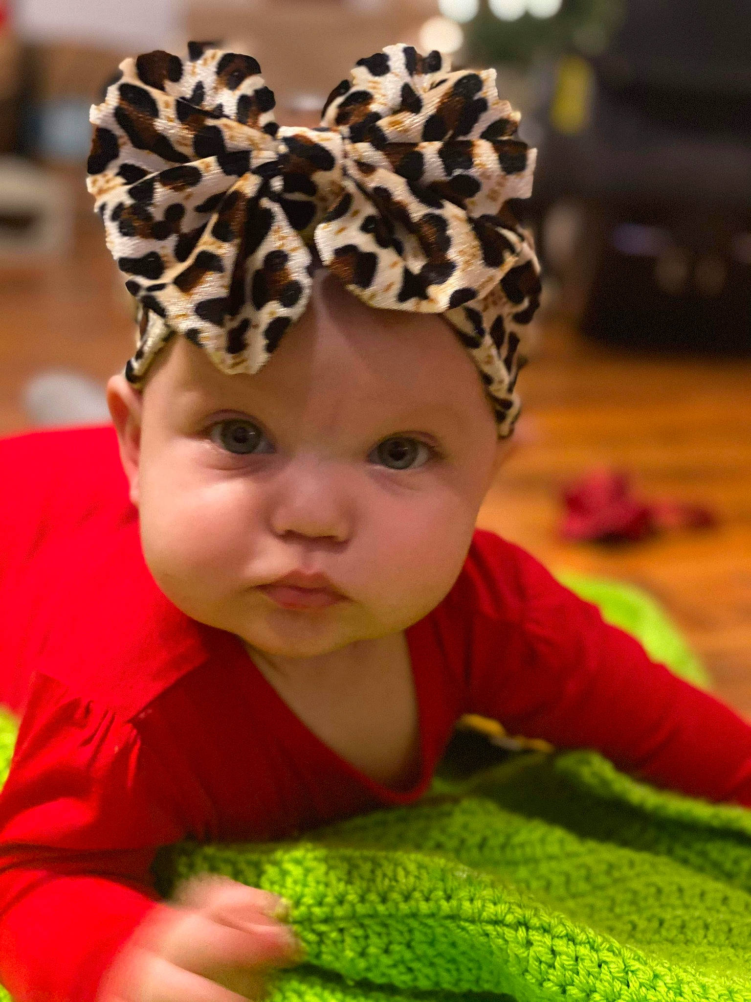 Annabella Love is registered to the contest to win money with this photo: baby, baby_toddler_clothing, cap, chin, face, fawn, finger, grass, green, hairstyle, happy, headband, headgear, headpiece, headwear, leaf, person, photograph, pink, skin