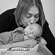 Paola participe au concours pour gagner de l'argent avec cette photo : adult, baby, basket, bed, bodypart, cradle, crib, face, female, finger, furniture, hand, head, infantbed, newborn, person, photography, portrait, sleeping, woman