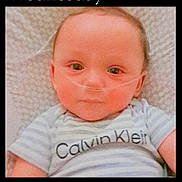 Justice joined the competition — help win amazing prizes! baby, infant, nasal_cannula, striped_shirt, calvin_klein, blanket, closeup, face, portrait, lying_down, child, medical_device, cute, indoors, young, person, head, expression, eyes, soft_lighting