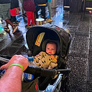 Jace joined the competition — help win amazing prizes! baby, blanket, canopy, child, city, curious, footwear, hand, infant, jacket, outdoor, pedestrian, people, person, rain, street, stroller, urban, walking, wet_pavement