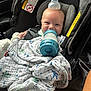 Jace joined the competition — help win amazing prizes! baby, car_seat, bottle, blanket, smiling, child, infant, seatbelt, clothing, indoors, headwear, happy, person, sitting, fabric, transportation, comfort, cute, feeding, safety