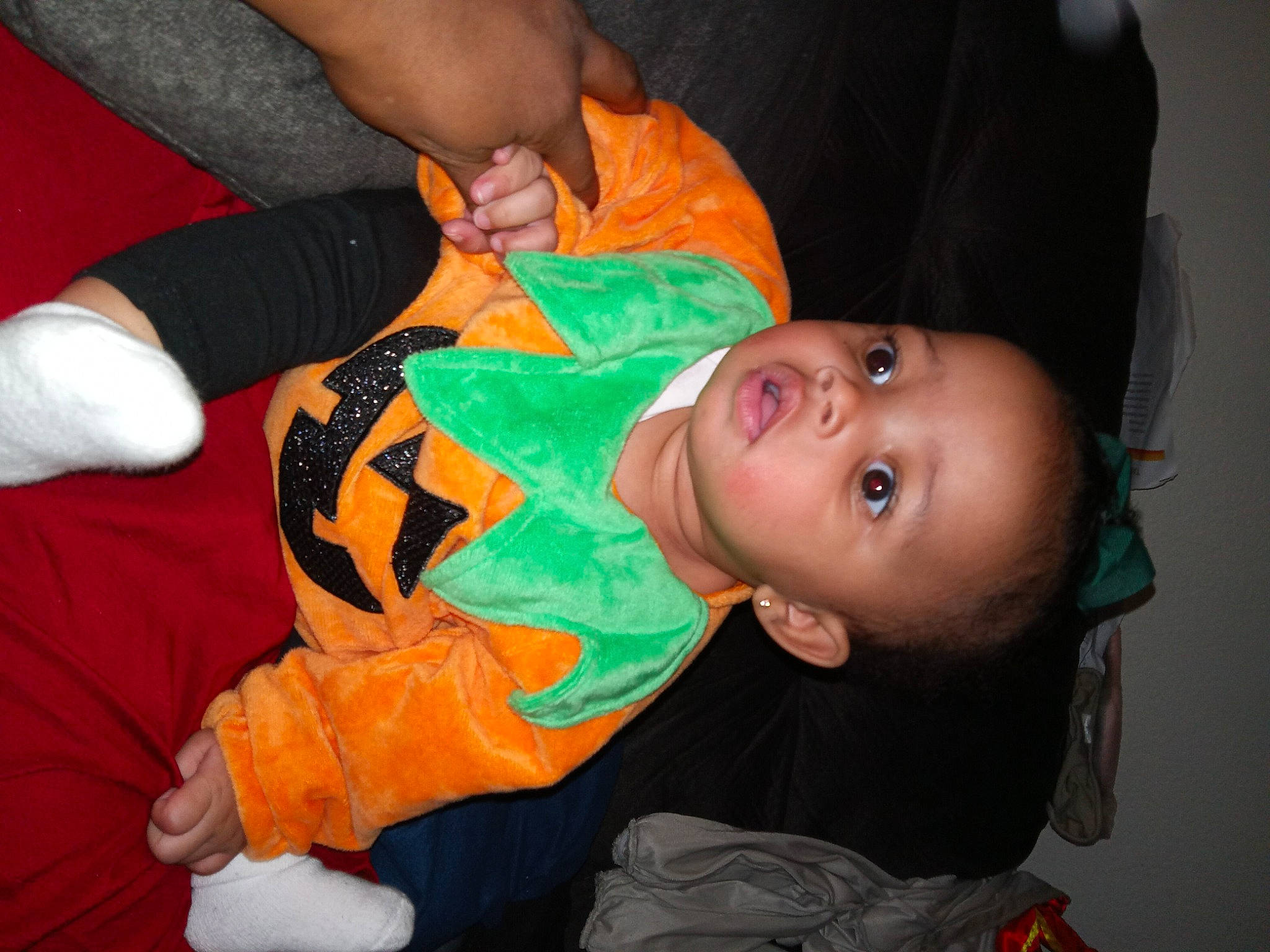 Keian'Iy joined the competition — help win amazing prizes! baby, baby_toddler_clothing, cheek, child, comfort, elbow, event, finger, fun, hand, leg, mouth, nose, orange, person, room, sitting, sleeve, thumb, toddler