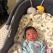 Kaitlyn Skyler is registered to the contest to win money with this photo: newborn, baby, infant, child, portrait, stroller, blanket, plush_toys, hanging_toys, snoopy, onesie, sleeping_basket, wide_eyed, indoors, cozy, cuddled, baby_clothing, soft_blanket, pastel_colors, close_up